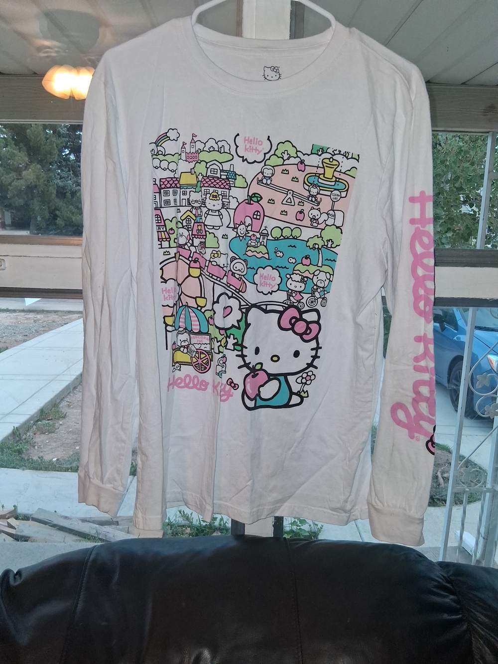 The product is a Hello Kitty graphic long sleeve shirt in size M.